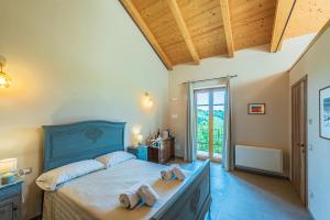 Postel nebo postele na pokoji v ubytování LeCoste rooms, Monforte