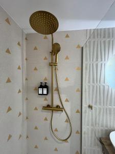 a shower in a bathroom with a wall at Marusía in Muxia +31 photos