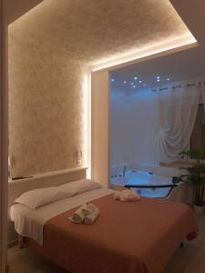 A bed or beds in a room at Il Mare di Roma Deluxe