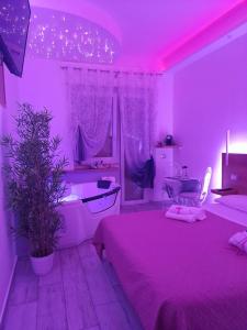 A bed or beds in a room at Il Mare di Roma Deluxe