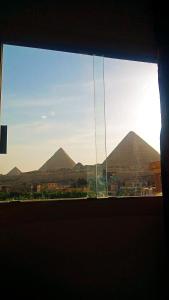 a view of the pyramids from a window at pyramids show hotel in Cairo
