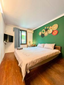 Postel nebo postele na pokoji v ubytování Bamboo Home