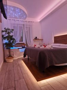 A bed or beds in a room at Il Mare di Roma Deluxe