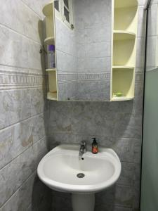 a bathroom with a sink and a mirror at Yassine's home in Jijel +29 photos
