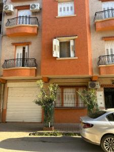 a car parked in front of a building at Yassine's home in Jijel