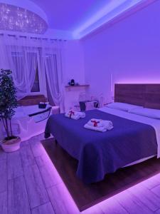 A bed or beds in a room at Il Mare di Roma Deluxe
