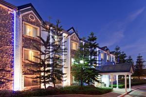 a building with lights on the side of it at Microtel by Wyndham Baguio in Baguio