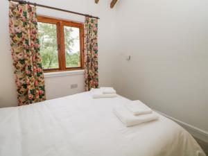 Postel nebo postele na pokoji v ubytování Bay Tree Cottage