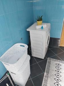 a bathroom with a toilet and a sink at Apartment Ross in Vlorë