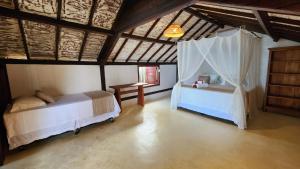 Cama o camas de una habitación en Villa Luar Caraíva - Pé na areia