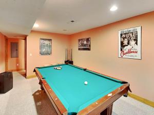 a pool table in a living room with at Tranquil Dreams in Oakland