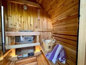 a inside of a wooden cabin with a stove at Purple City Retreats - Luxury Yurt & Spa in Portland +31 photos