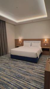 Voodi või voodid majutusasutuse شقق هوليداي بلس مشرفه - Holiday Plus Mishrifah Apartments toas