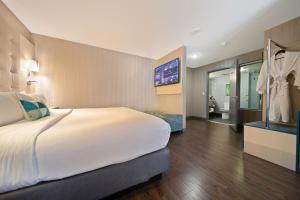 Katil atau katil-katil dalam bilik di Hotel BLU