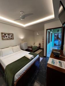 Cama ou camas em um quarto em Porto Abraão Pousada