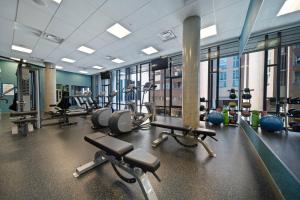 a gym with several treadmills and exercise bikes at Hotel BLU in Vancouver