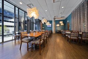 a dining room with a long table and chairs at Hotel BLU in Vancouver