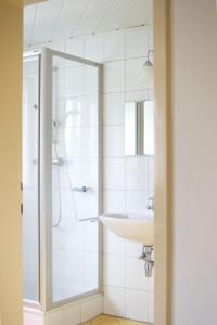 a bathroom with a sink and a shower at Ferienhaus Koglegg in Unterfresen