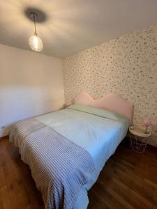 a bedroom with a bed in a room at Areas Gordas in Cangas de Morrazo +12 photos