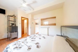 Postel nebo postele na pokoji v ubytování B&B Osteria dello sperone