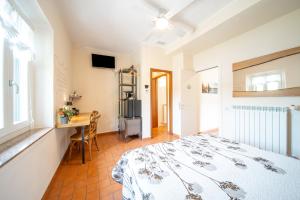 Postel nebo postele na pokoji v ubytování B&B Osteria dello sperone