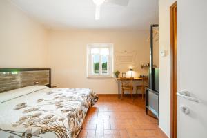 Postel nebo postele na pokoji v ubytování B&B Osteria dello sperone