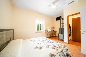 Postel nebo postele na pokoji v ubytování B&B Osteria dello sperone