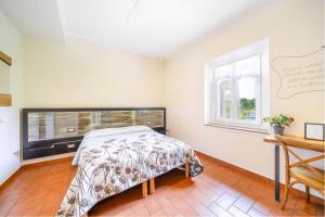 Postel nebo postele na pokoji v ubytování B&B Osteria dello sperone