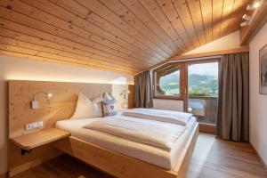 Tempat tidur dalam kamar di Eden Appartements