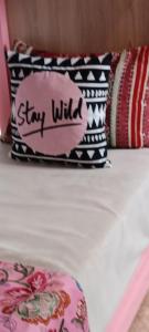a group of pillows with the words stay wild at SULTANA Beach Riad in Saidia 