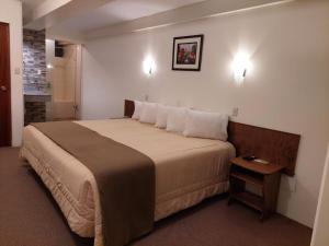 Postel nebo postele na pokoji v ubytování Hotel Munay Tambo + 37 fotografií
