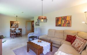 a living room with a couch and a table at Beautiful Apartment In Torrevieja in Torrevieja