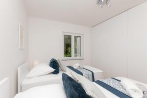 Postel nebo postele na pokoji v ubytování Apartman Maria