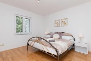 Postel nebo postele na pokoji v ubytování Apartman Maria