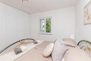 Postel nebo postele na pokoji v ubytování Apartman Maria