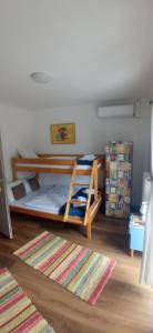 A bed or beds in a room at Servus Vendégház