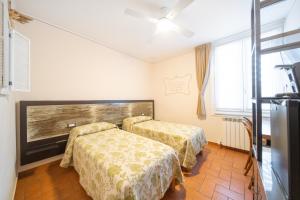 Postel nebo postele na pokoji v ubytování B&B Osteria dello sperone