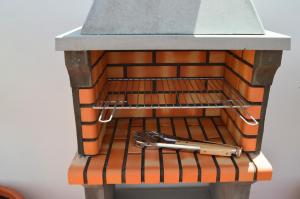 a kitchen counter with a sink and tongs on it at Mirafondo Beach in Playa Honda +95 photos