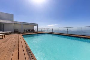 a swimming pool on the roof of a building at Xenon Urban Apartments in Maputo