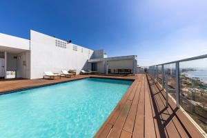 a swimming pool on the roof of a house at Xenon Urban Apartments in Maputo