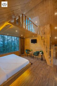 Postel nebo postele na pokoji v ubytování BlackPearl Cottage - Kufri