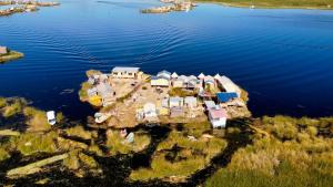 an aerial view of a small island in the water at Uros Aruma-Uro on Uros Floating Islands in Puno