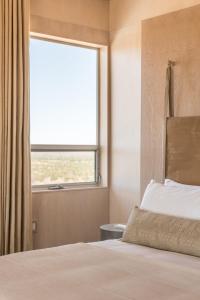 Una cama o camas en una habitación de Pause House - AM - your break in Joshua Tree