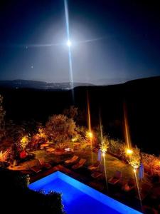 a view of a swimming pool at night at Les terrasses du Lac Marrakech in Lalla Takerkoust