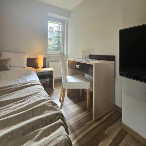 Posteľ alebo postele v izbe v ubytovaní Willa Jagiellonka apartamenty w centrum, parking