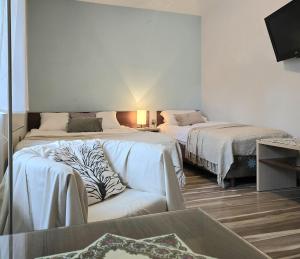 Posteľ alebo postele v izbe v ubytovaní Willa Jagiellonka apartamenty w centrum, parking
