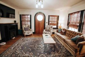 a living room with a couch and a fireplace at Fairy House by Eden Crest in Sevierville
