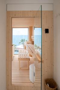 a wooden house with a view of the ocean at CALEA Boutique Hotel in Bacoli