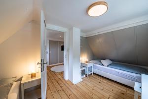 Кровать или кровати в номере Sonnenhäusle - Natur. Fernblick. Panorama-Sauna.