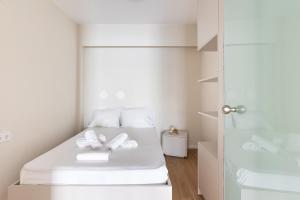 Ένα ή περισσότερα κρεβάτια σε δωμάτιο στο Harmonia Minimal Apartments